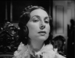 Agnes Moorehead as Mrs. Reed